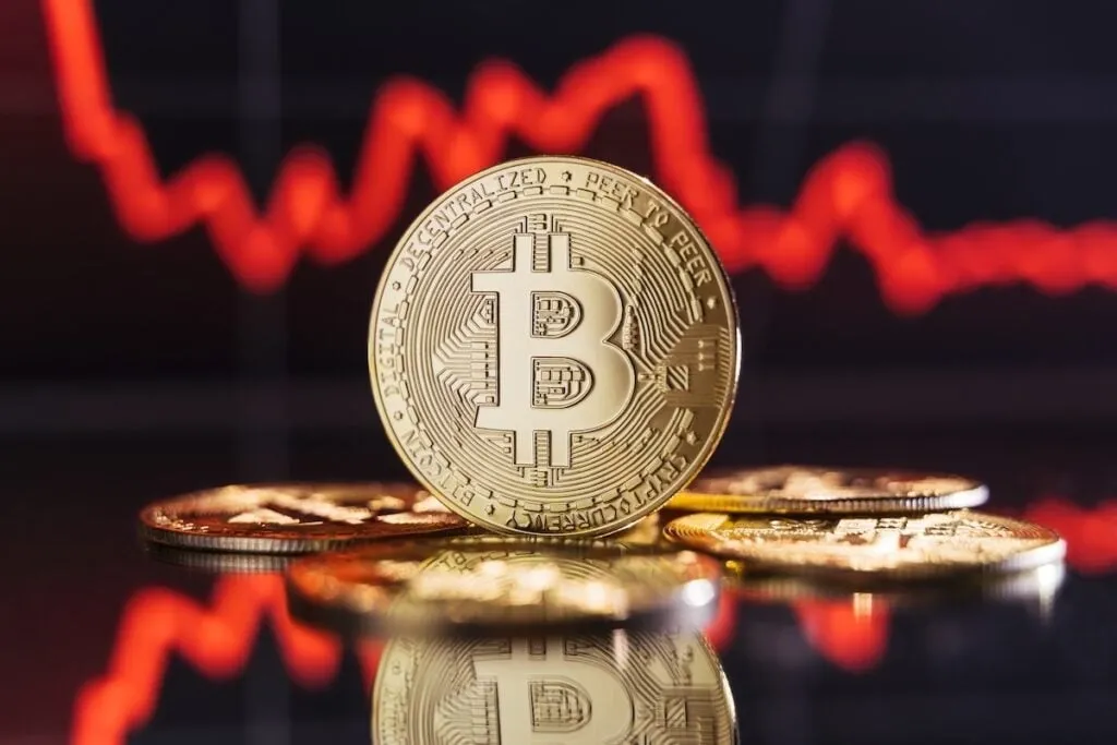 Bitcoin Dips Below $60,000 Amidst Market Volatility; Analysts Eye AI Trade Influence